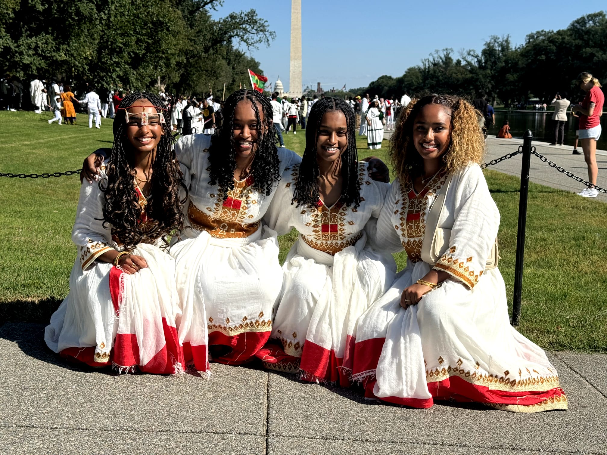 Oromo woman in traditional colorful dress celebrating at Irreecha festival